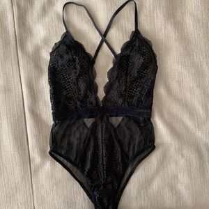 Victoria’s Secret black lace/mesh teddy.